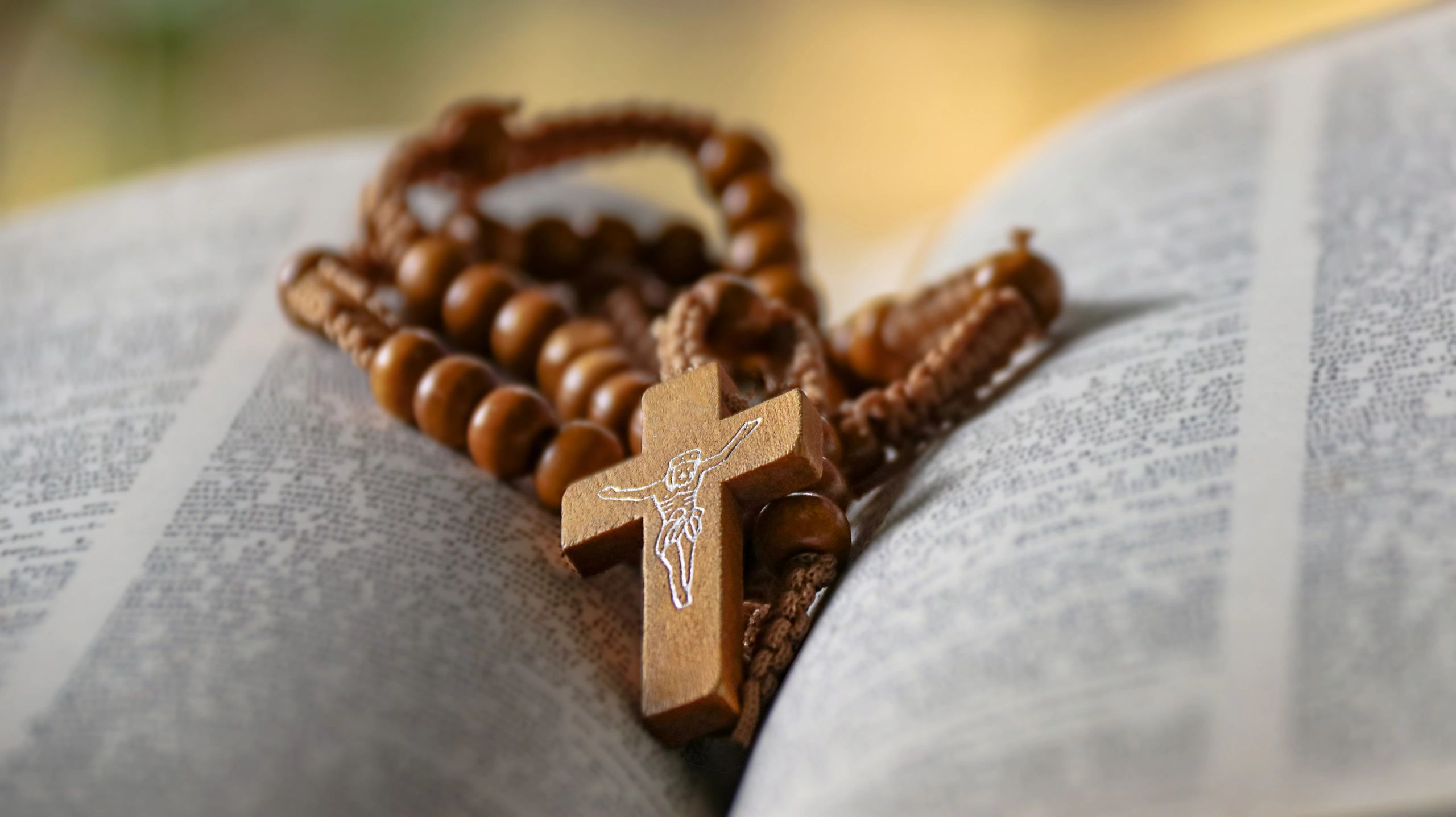 Wooden cross resting on an open book